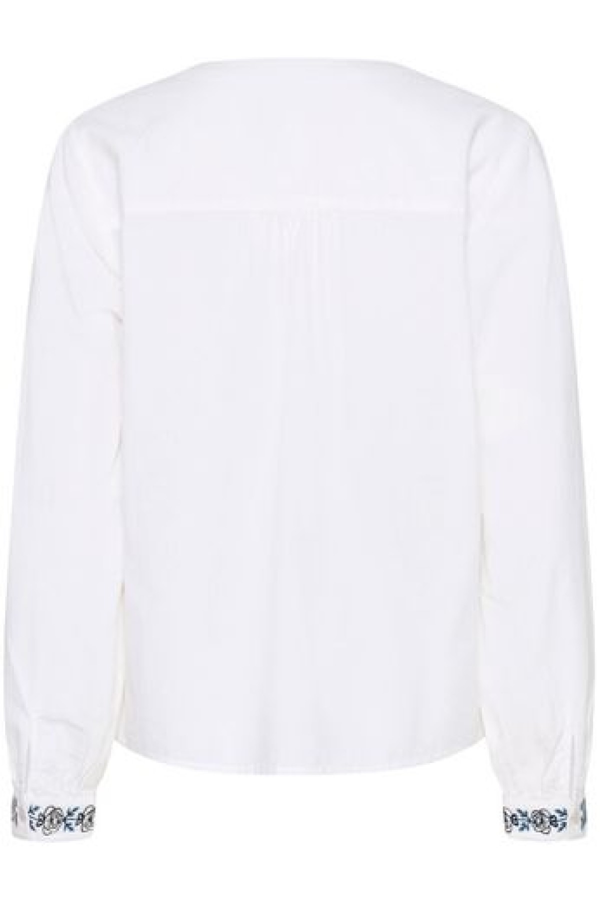 Cotton blouse with embroidery. It has a V-neck and a loose, comfortable fit.