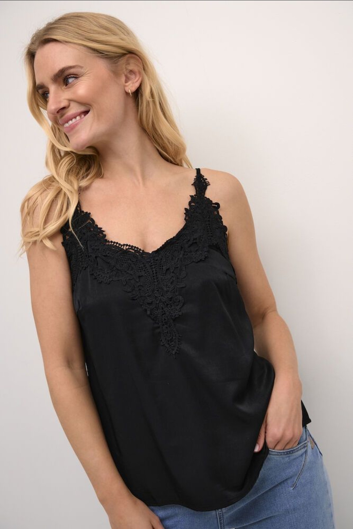 Lingerie  whith is lace detail around the neckline. Available in black and beige