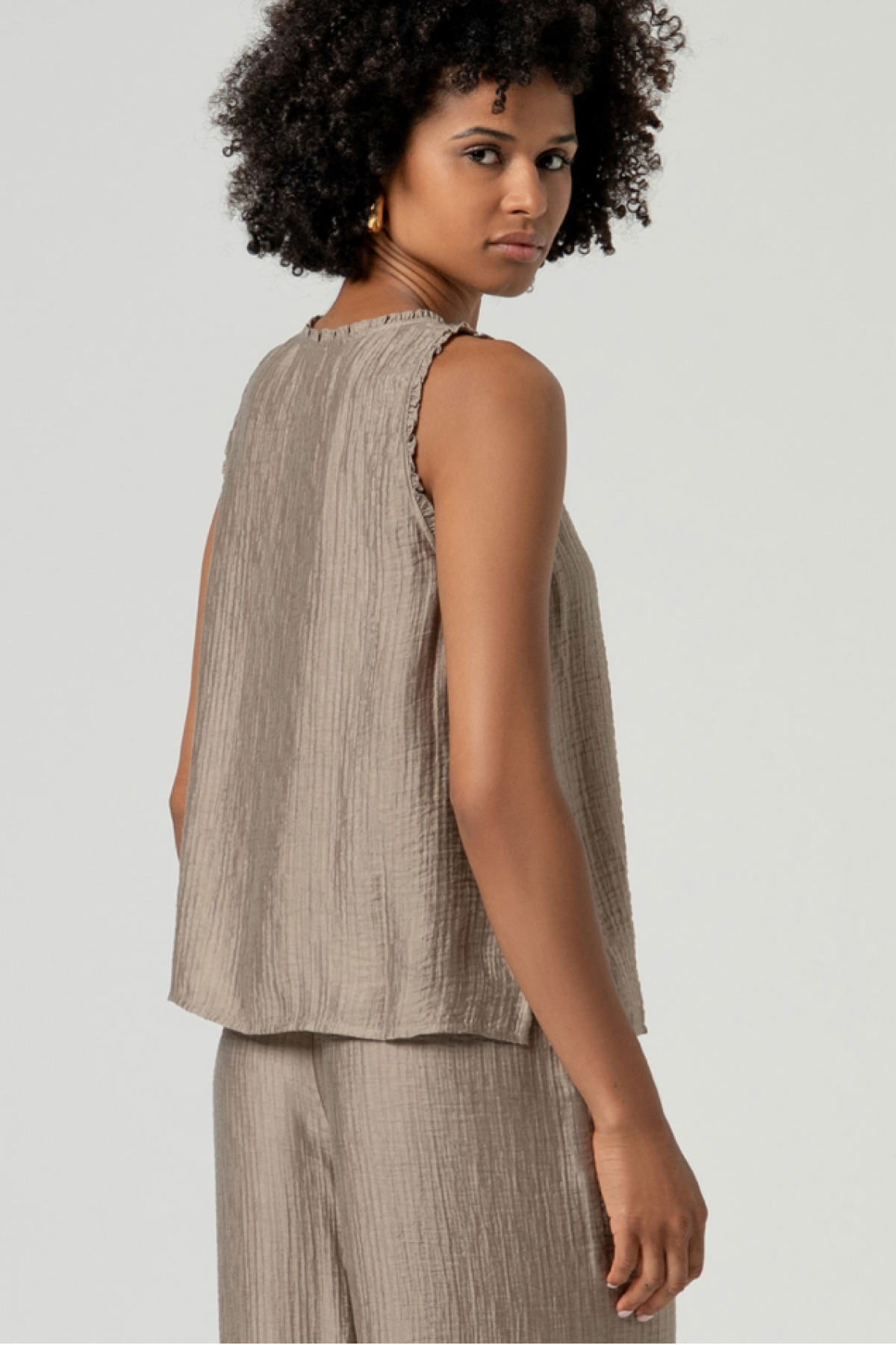 V-neck top with sleeveless.  Wear it with the matching pants