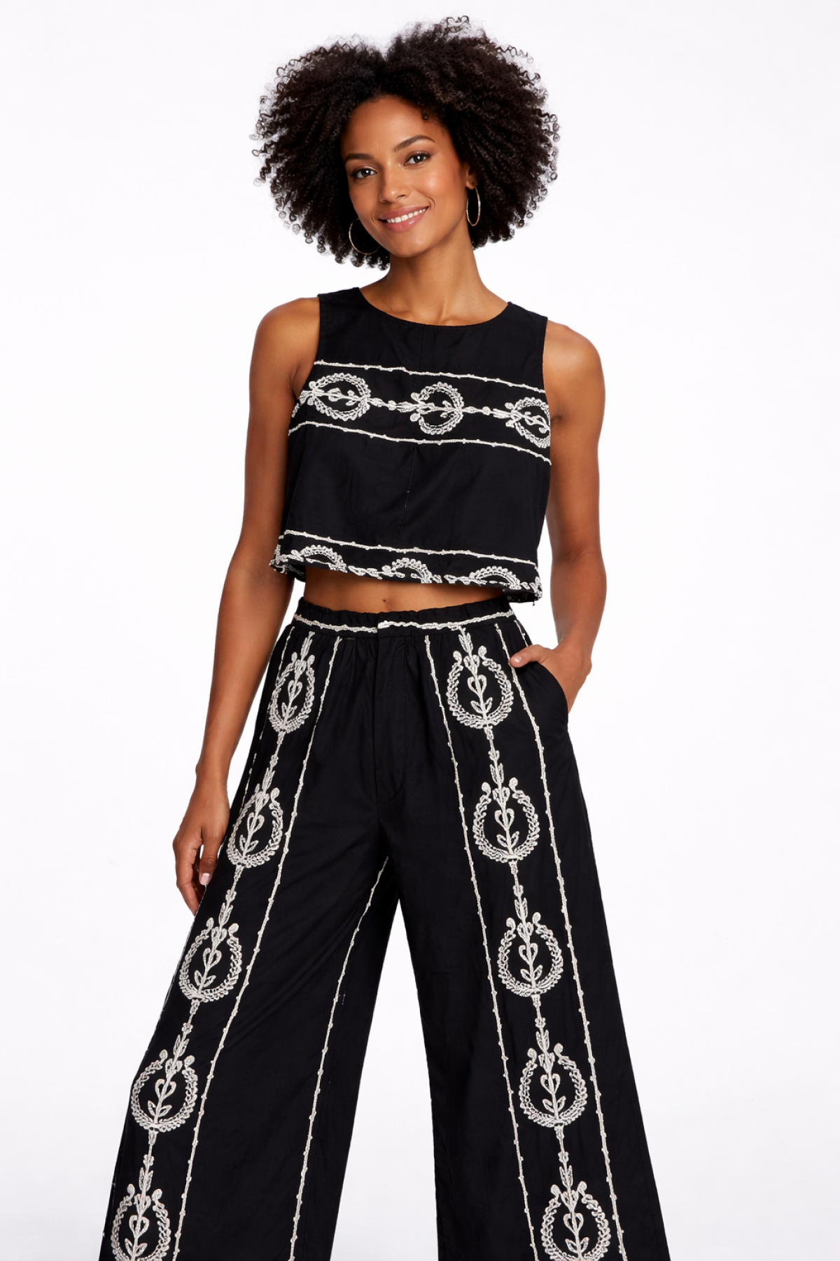 Sleeveless top with  white embroidery, wear it with the matching pants.