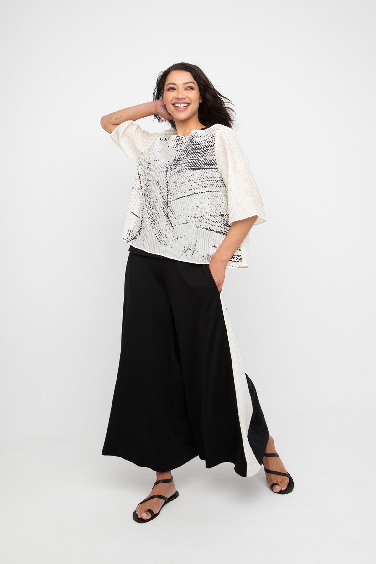 Loose fit bloose with black graffiti.