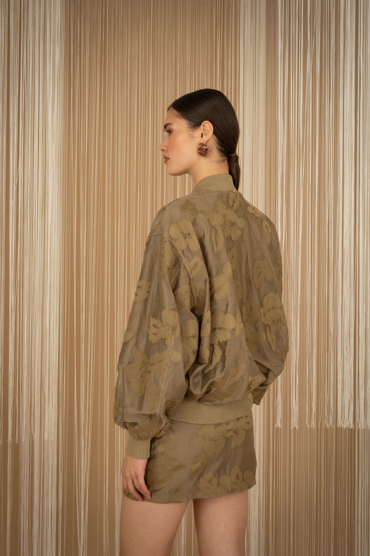 Embroidered floral bomber jacket.  For a complete look, pair them with the mini skirt from the same collection.