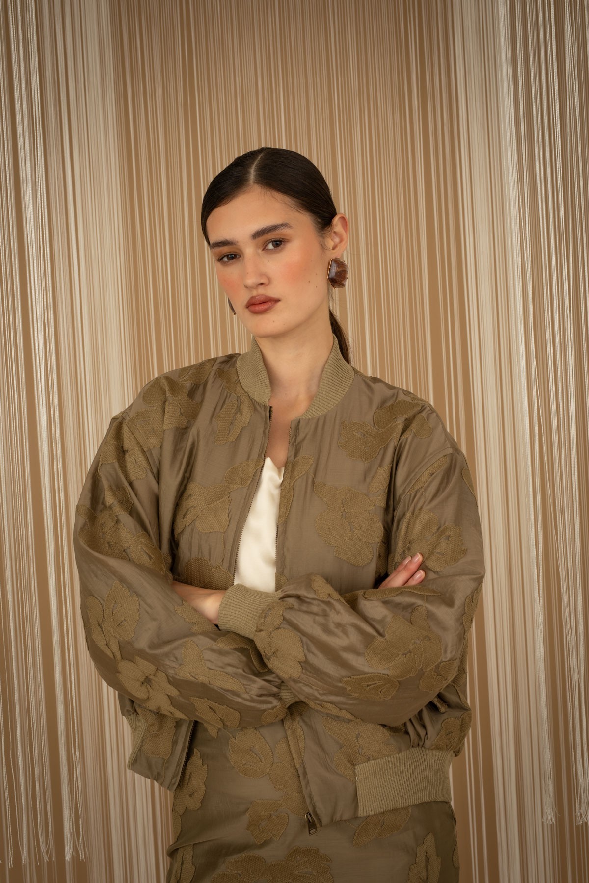 Embroidered floral bomber jacket.  For a complete look, pair them with the mini skirt from the same collection.