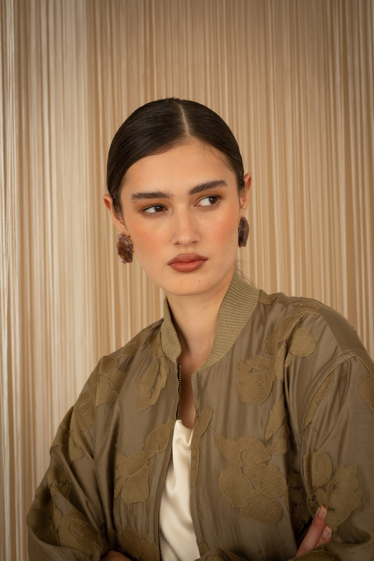 Embroidered floral bomber jacket.  For a complete look, pair them with the mini skirt from the same collection.