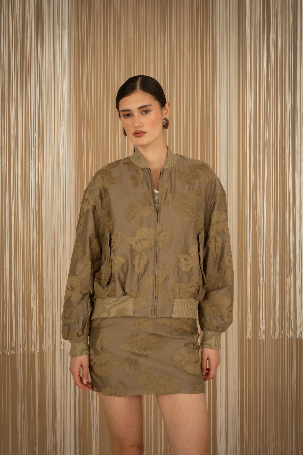 Embroidered floral bomber jacket.  For a complete look, pair them with the mini skirt from the same collection.