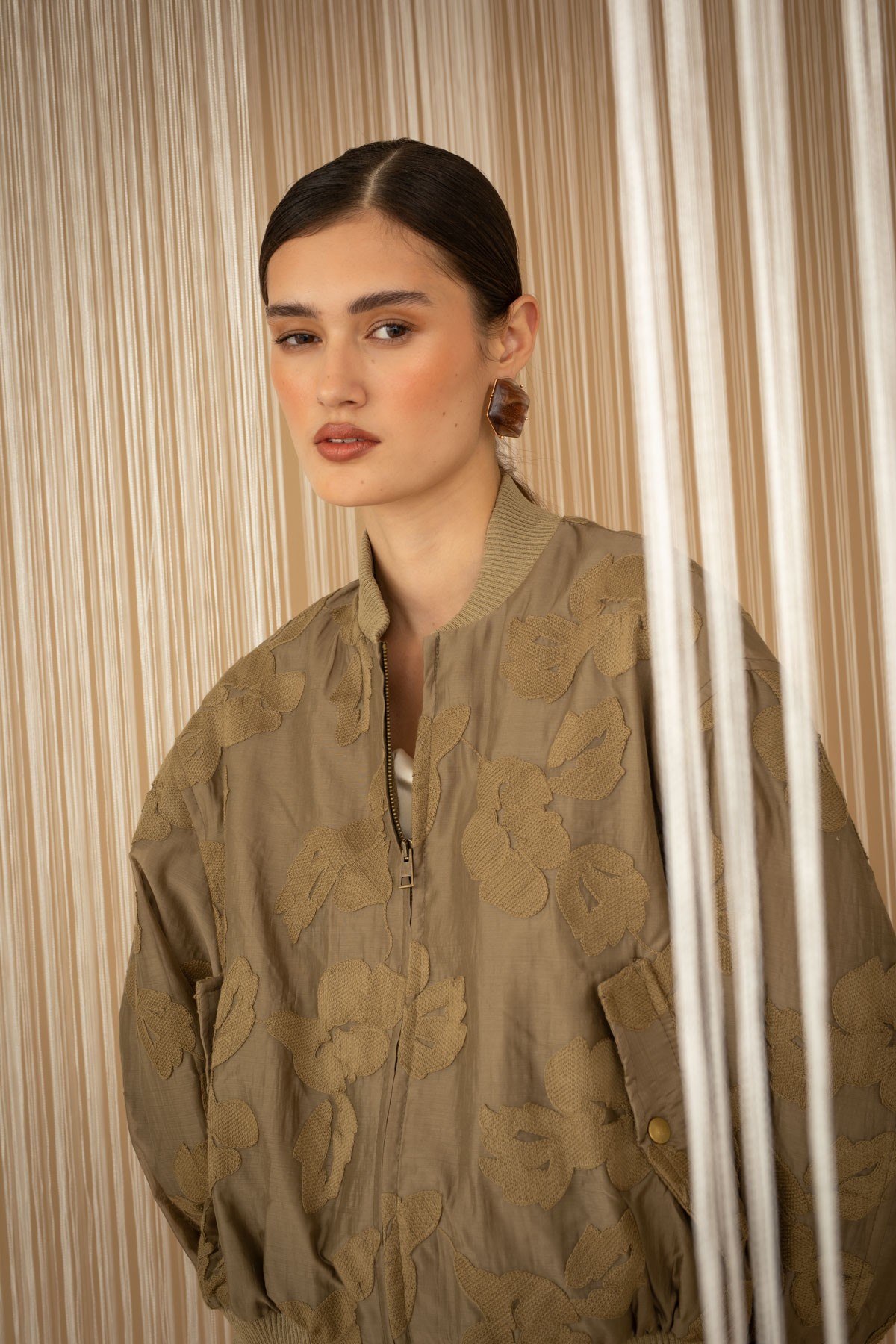 Embroidered floral bomber jacket.  For a complete look, pair them with the mini skirt from the same collection.