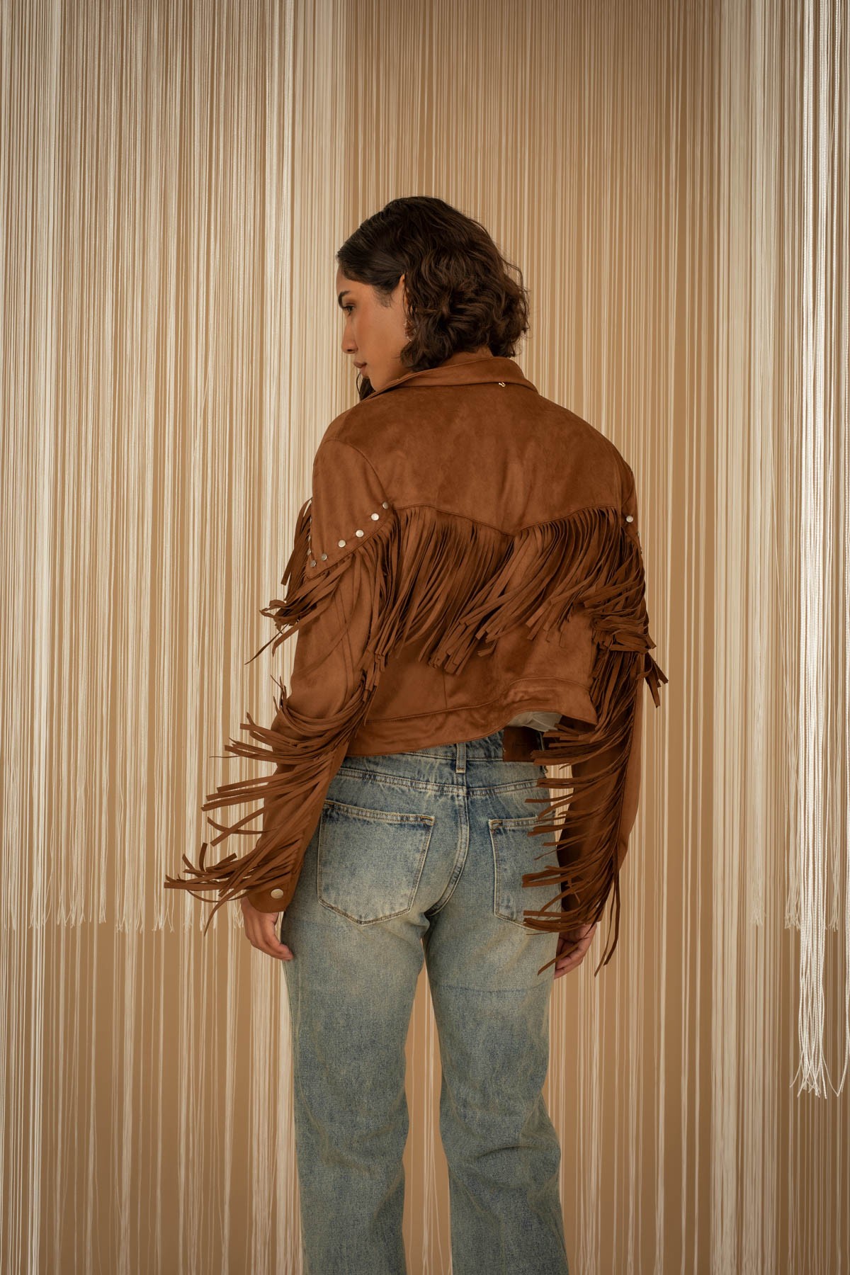 Jacket with fringes and studs