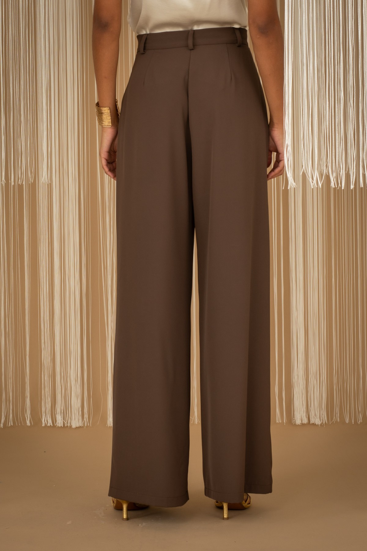 Pleated wide-leg pants.  For a complete look, pair them with the blazer from the same collection.