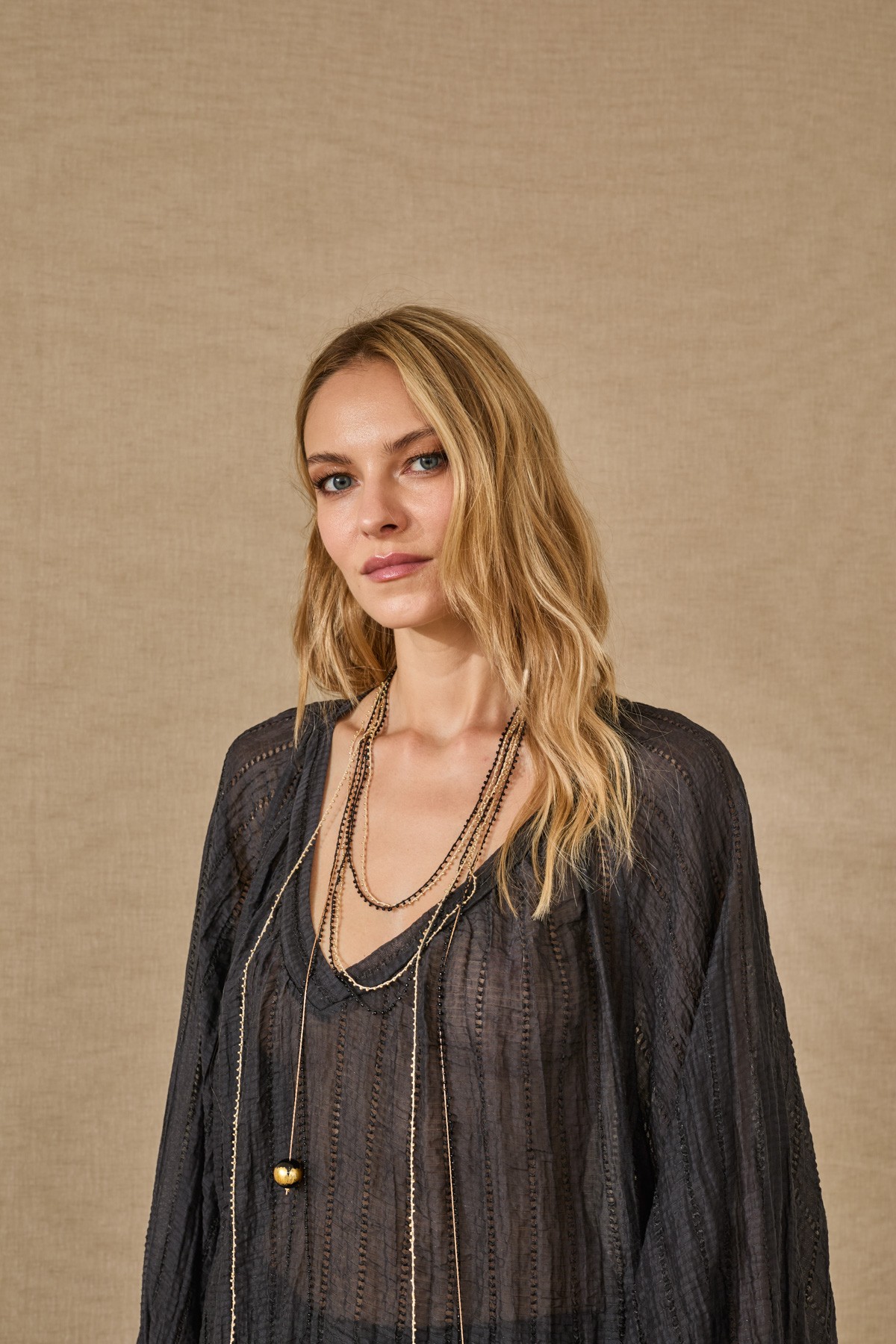 Light, flowy blouse with sleeves. For a complete look, pair them with the  pants from the same collection.