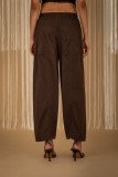 Wide-leg pants with elastic waist, available in black and ecru.