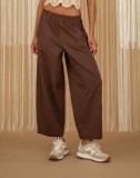 Wide-leg pants with elastic waist, available in black and ecru.