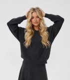 Oversized knit sweater in charcoal color with deep V-neckline